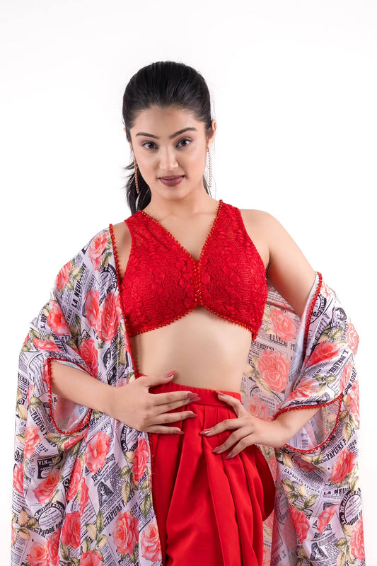 Blood Red Draped Dhoti Pants Paired With A Lace Crop Top and A Printed Shrug.