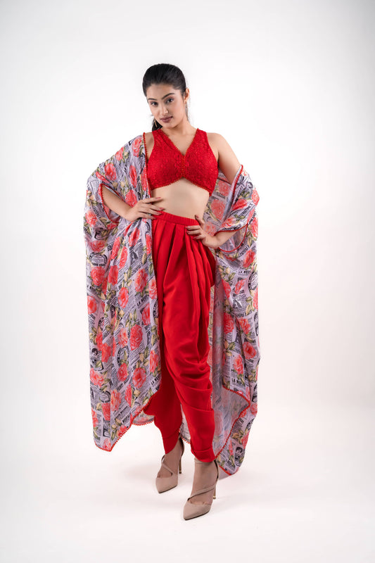 Blood Red Draped Dhoti Pants Paired With A Lace Crop Top and A Printed Shrug.